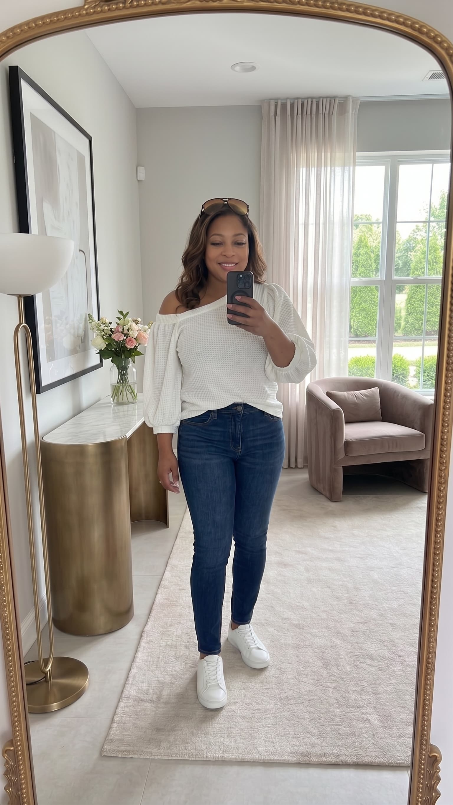 Fashionable person taking a mirror selfie to illustrate K Scan AI Mirror Selfie wardrobe intake.